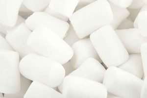 Close-up of white marshmallows on a white background