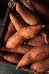 A crate of sweet potatoes for horse feed