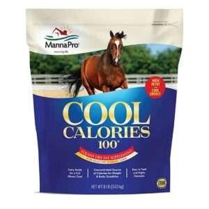 A bag of MannaPro Cool Calories 100 equine dry fat supplement with a blue label and a red 'New' sticker, featuring a photo of a brown horse and benefits including easy to feed pellets and support for healthy weight gain